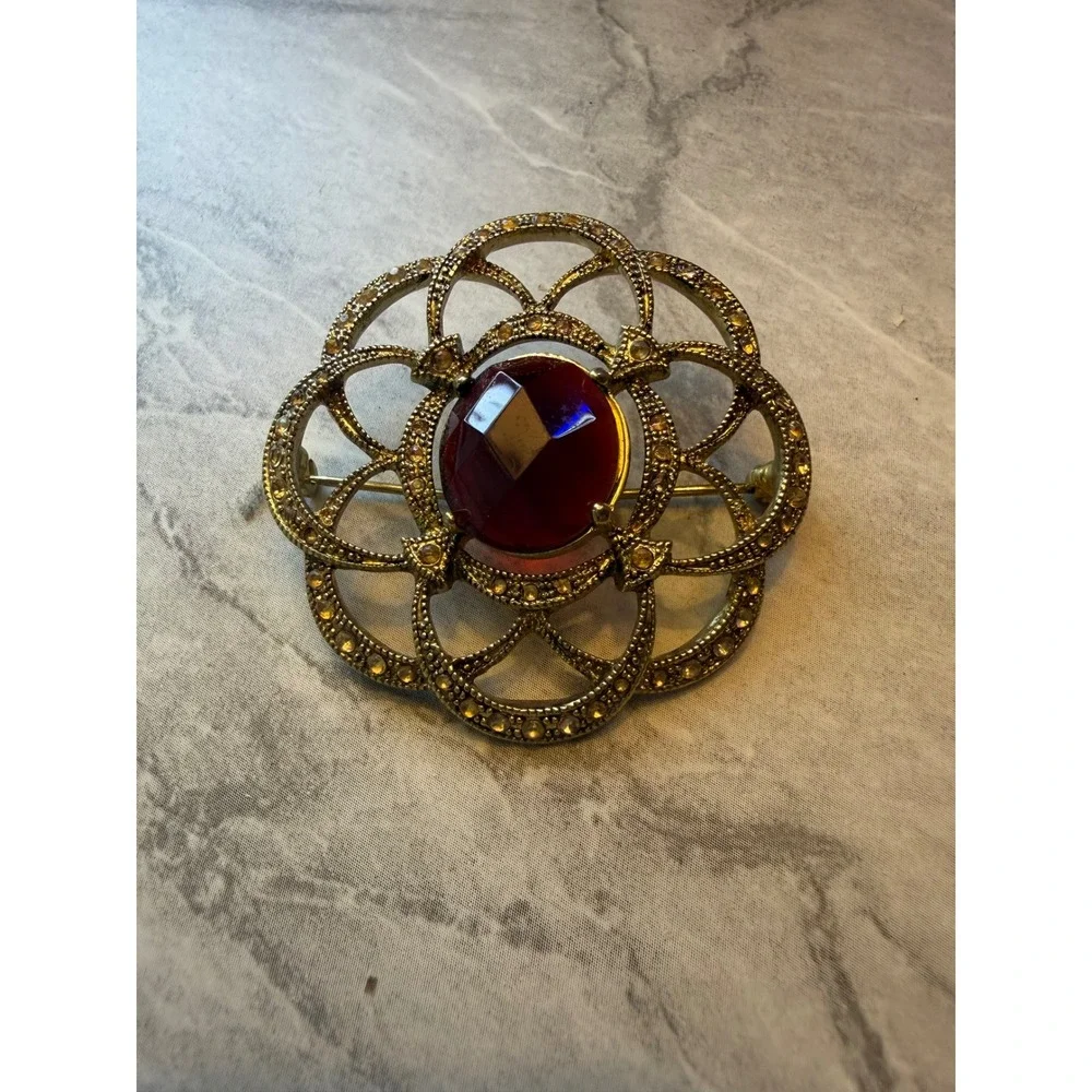 Vintage Monet Gold Tone Red Stone Rhinestone Floral Openwork Brooch Pin